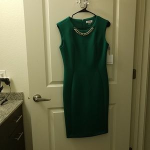 Calvin Klein sheath dress with chain detail.